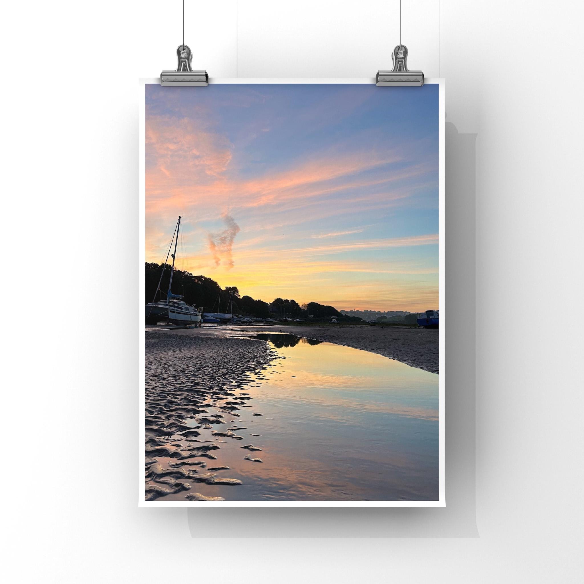 Print of a sunrise over a beach with boats, clipped to a white background.