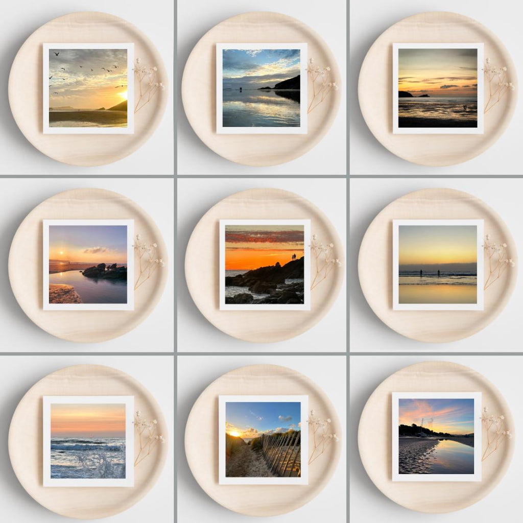 Nine circular frames with greetings cards showing scenic images of landscapes on a white background