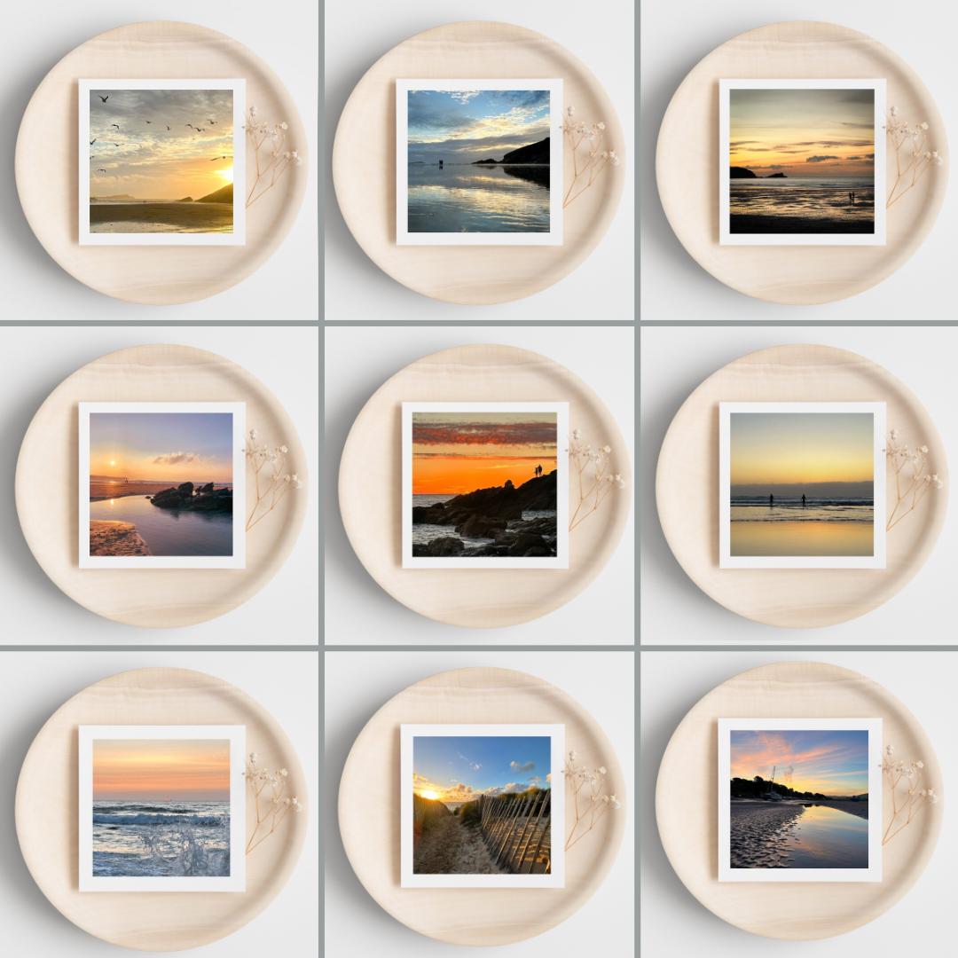 Nine circular frames with greetings cards showing scenic images of landscapes on a white background